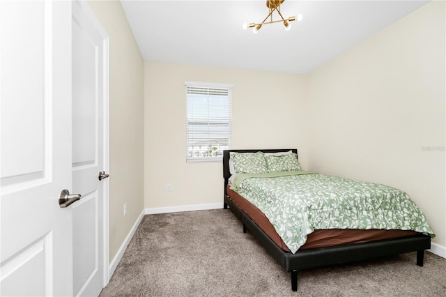 2919 Verse St, Kissimmee, FL 34746 - bedroom with baseboards, carpet flooring, and a notable chandelier