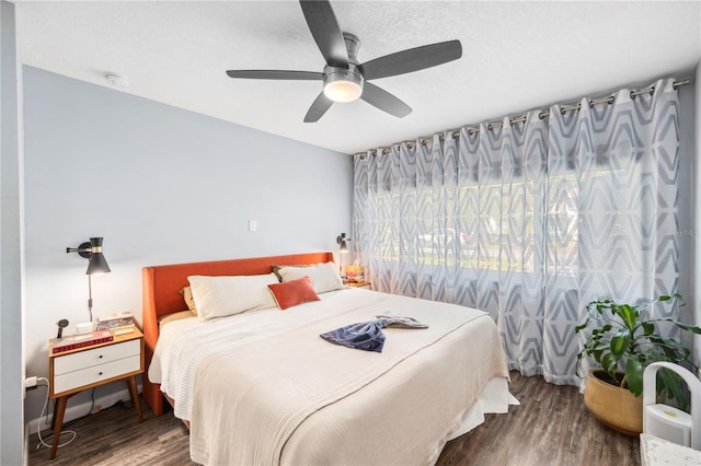 bedroom featuring ceiling fan and wood finished floors