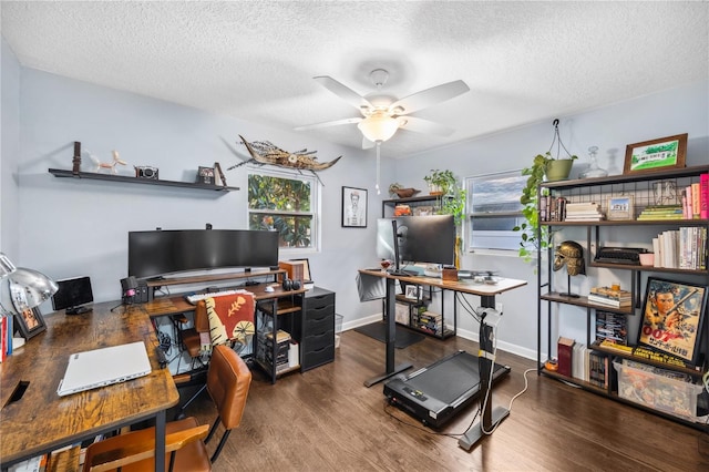 office space with baseboards, ceiling fan, a textured ceiling, and wood finished floors
