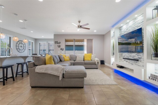 15443 Sugarcup Ct, Orlando, FL 32828 - living room featuring a ceiling fan, light tile patterned flooring, and recessed lighting