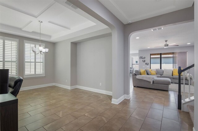 15443 Sugarcup Ct, Orlando, FL 32828 - tiled living room with a ceiling fan, recessed lighting, arched walkways, baseboards, and a chandelier