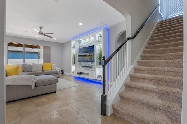 15443 Sugarcup Ct, Orlando, FL 32828 - living room featuring stairway, a ceiling fan, recessed lighting, and light tile patterned floors