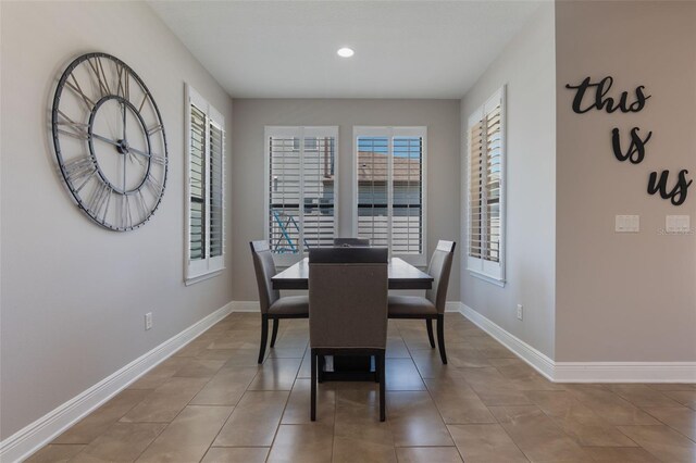 15443 Sugarcup Ct, Orlando, FL 32828 - tiled dining space featuring baseboards and recessed lighting