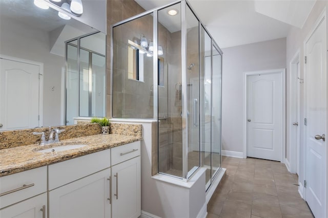 15443 Sugarcup Ct, Orlando, FL 32828 - full bath featuring a stall shower, baseboards, vanity, and tile patterned flooring