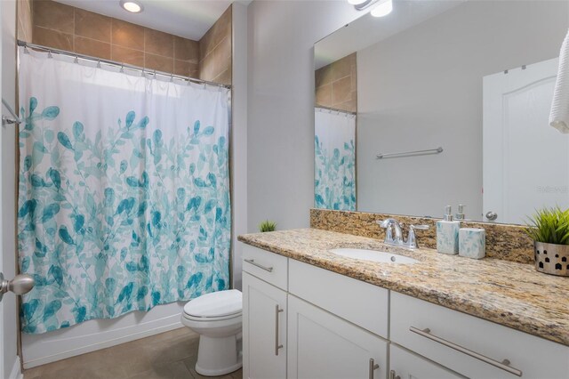 15443 Sugarcup Ct, Orlando, FL 32828 - bathroom with tile patterned flooring, vanity, toilet, and shower / tub combo with curtain