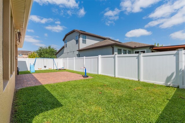 15443 Sugarcup Ct, Orlando, FL 32828 - view of yard featuring a patio area