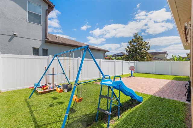 15443 Sugarcup Ct, Orlando, FL 32828 - view of play area with a patio