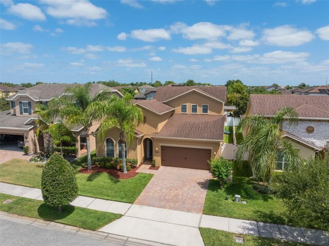 15443 Sugarcup Ct, Orlando, FL 32828 - view of front of house featuring stucco siding, a residential view, and driveway