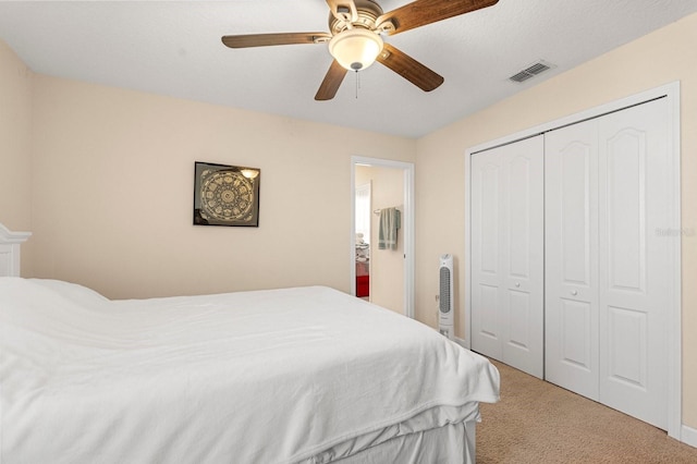 bedroom with carpet floors, a closet, and ceiling fan