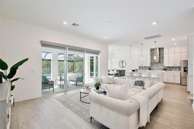 10139 Austrina Oak Loop, Winter Garden, FL 34787 - living area featuring recessed lighting, visible vents, and light wood finished floors