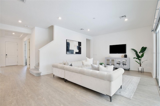 10139 Austrina Oak Loop, Winter Garden, FL 34787 - living room featuring light wood-style floors, recessed lighting, stairs, and baseboards