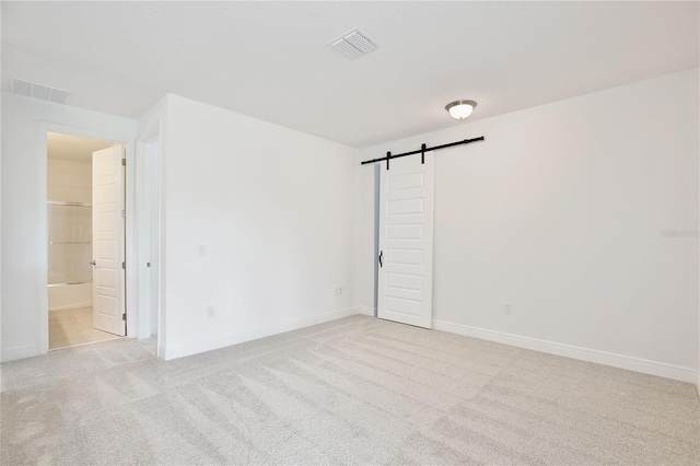 10139 Austrina Oak Loop, Winter Garden, FL 34787 - unfurnished room with baseboards, light colored carpet, a barn door, and visible vents