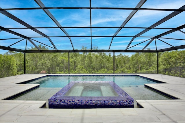10139 Austrina Oak Loop, Winter Garden, FL 34787 - view of pool with a patio, a view of trees, and a pool with connected hot tub