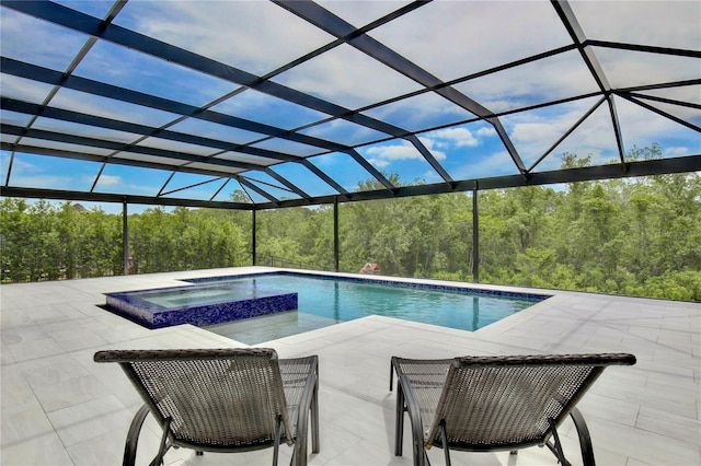 10139 Austrina Oak Loop, Winter Garden, FL 34787 - view of pool featuring glass enclosure, a patio area, and a pool with connected hot tub