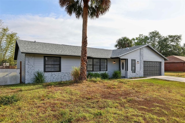 4510 Bonanza St, Cocoa, FL 32927 - ranch-style home with driveway, a shingled roof, a front lawn, and a garage