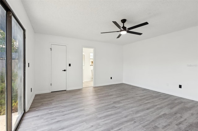 4510 Bonanza St, Cocoa, FL 32927 - spare room featuring baseboards, a textured ceiling, ceiling fan, and light wood-style flooring