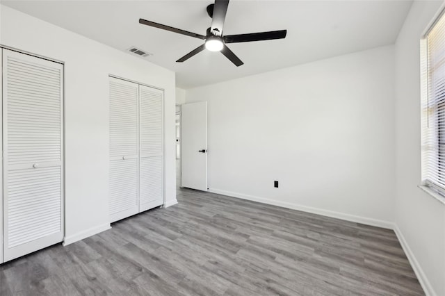 4510 Bonanza St, Cocoa, FL 32927 - unfurnished bedroom with two closets, visible vents, and wood finished floors