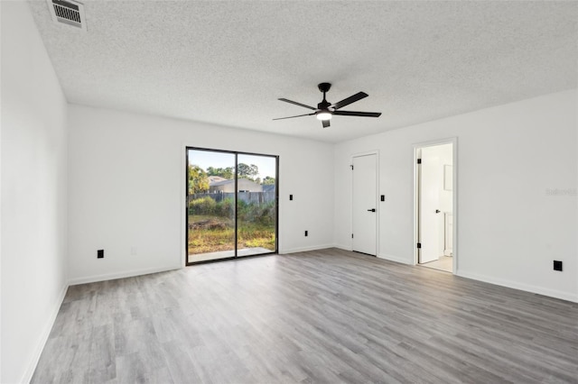 4510 Bonanza St, Cocoa, FL 32927 - spare room with visible vents, wood finished floors, baseboards, ceiling fan, and a textured ceiling