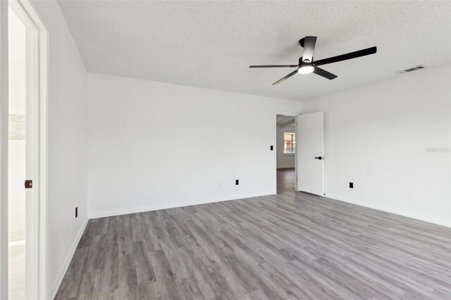 4510 Bonanza St, Cocoa, FL 32927 - spare room with a ceiling fan, a textured ceiling, visible vents, wood finished floors, and baseboards