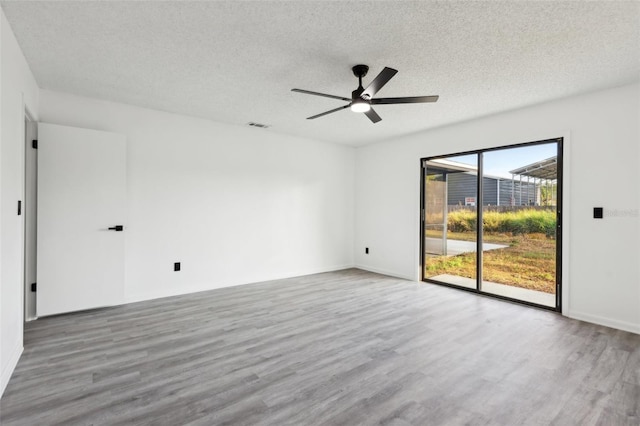 4510 Bonanza St, Cocoa, FL 32927 - empty room with visible vents, a textured ceiling, ceiling fan, and wood finished floors