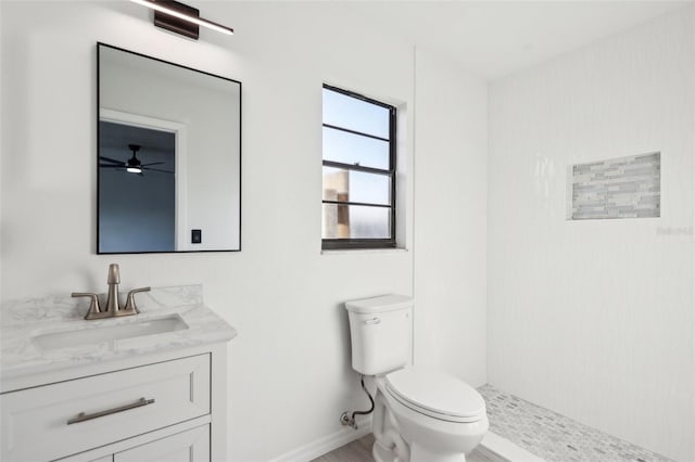 4510 Bonanza St, Cocoa, FL 32927 - full bathroom featuring ceiling fan, walk in shower, vanity, baseboards, and toilet