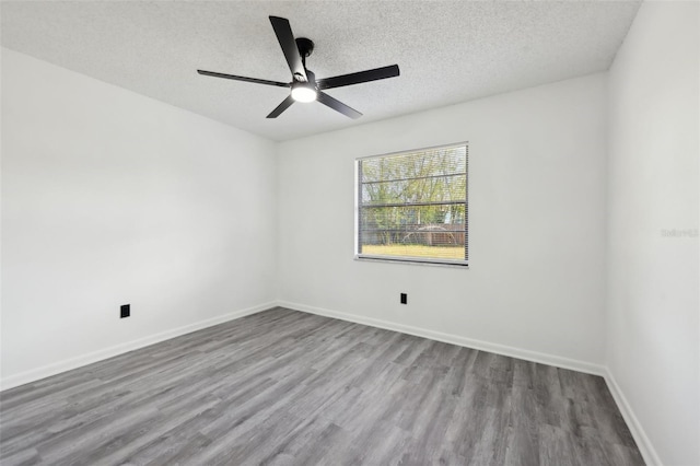 4510 Bonanza St, Cocoa, FL 32927 - spare room with baseboards, a ceiling fan, a textured ceiling, and wood finished floors