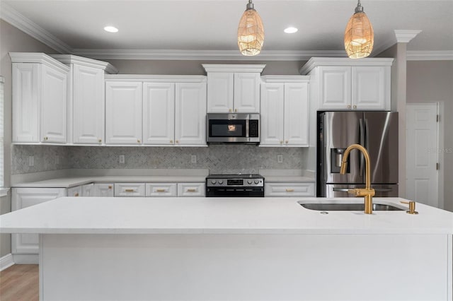 kitchen with white cabinets, light countertops, stainless steel appliances, decorative light fixtures, and tasteful backsplash