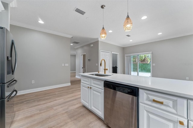 kitchen with white cabinets, appliances with stainless steel finishes, a sink, light wood-style floors, and visible vents
