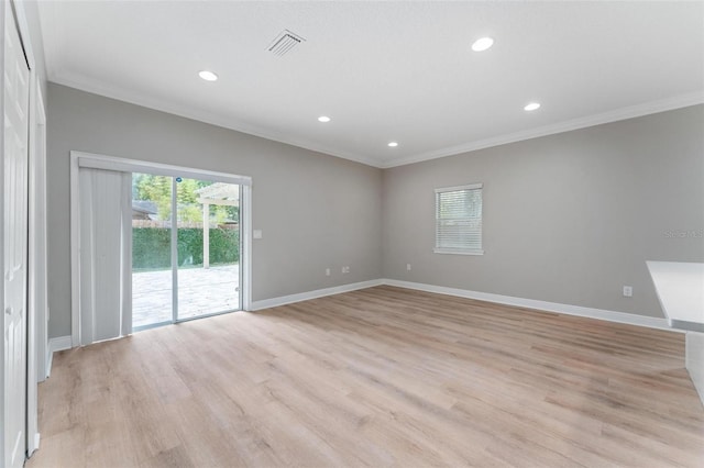 empty room with baseboards, ornamental molding, recessed lighting, and visible vents