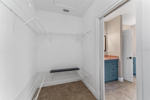 walk in closet featuring visible vents