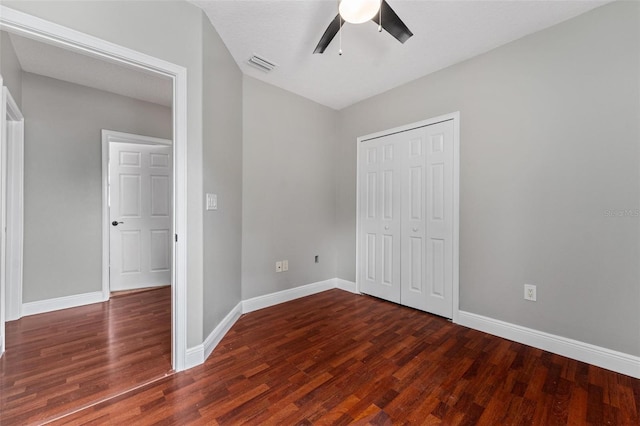 unfurnished bedroom with baseboards, visible vents, and wood finished floors