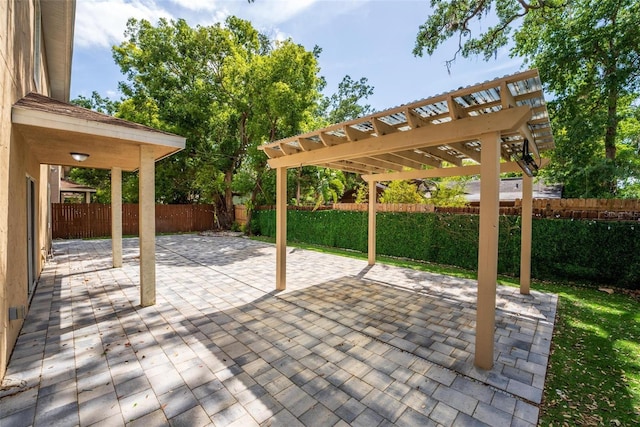 view of patio with a pergola and a fenced backyard