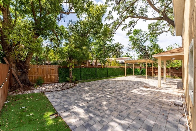 view of patio with a fenced backyard and a pergola