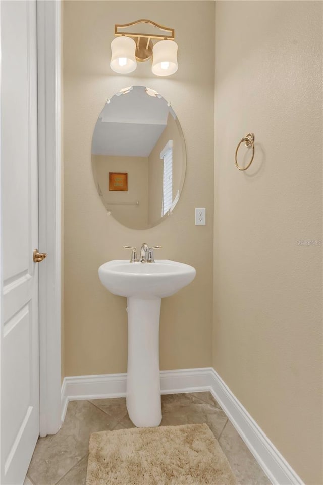 bathroom featuring tile patterned floors and baseboards