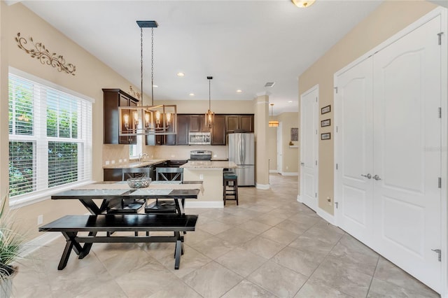 dining space featuring visible vents, baseboards, a notable chandelier, recessed lighting, and light tile patterned flooring