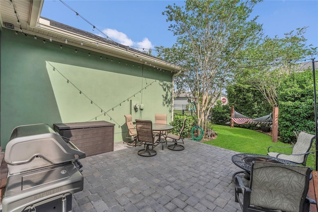 view of patio / terrace featuring outdoor dining space and grilling area