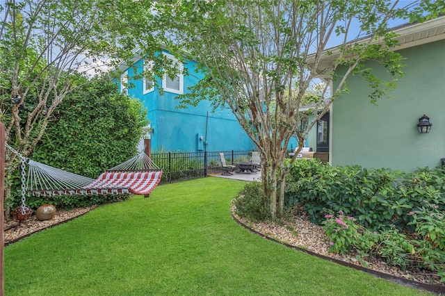 view of yard featuring a patio and fence