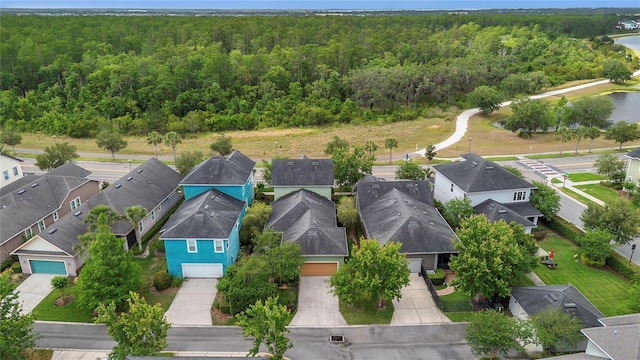 bird's eye view featuring a residential view and a view of trees