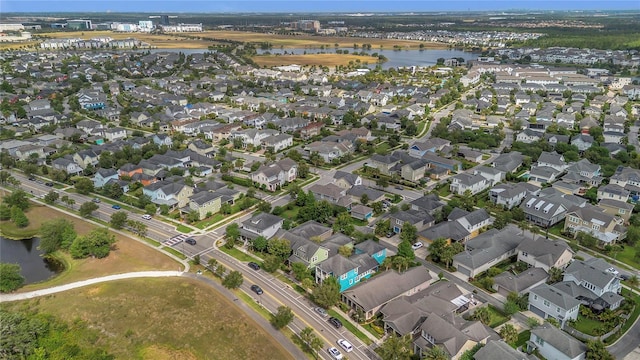 bird's eye view with a residential view and a water view