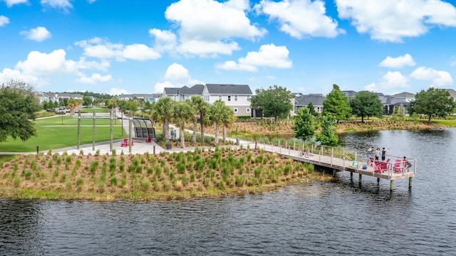exterior space with a water view and a residential view