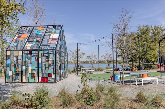 surrounding community featuring a water view
