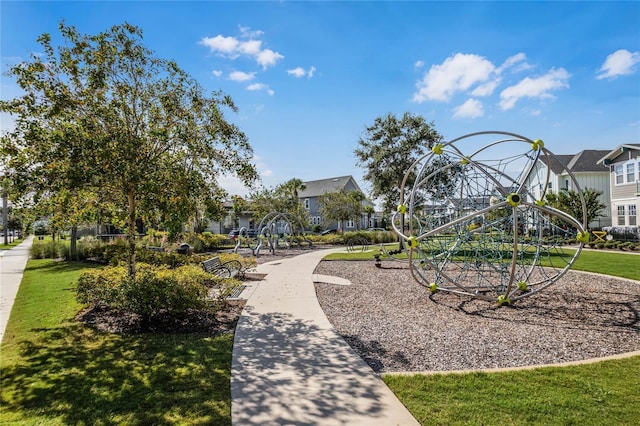 view of home's community with a residential view, a lawn, and playground community