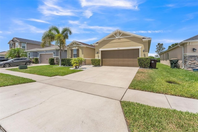 2815 Shelburne Way, Saint Cloud, FL 34772 - view of front facade featuring an attached garage, stucco siding, a front yard, and concrete driveway