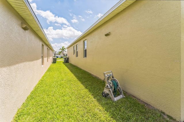 2815 Shelburne Way, Saint Cloud, FL 34772 - view of home's exterior with stucco siding and a yard