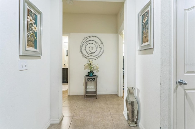 2815 Shelburne Way, Saint Cloud, FL 34772 - hallway featuring baseboards and light tile patterned flooring