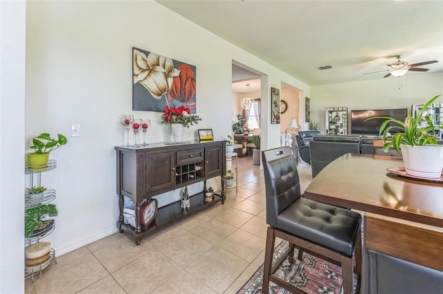 2815 Shelburne Way, Saint Cloud, FL 34772 - dining space with visible vents, baseboards, ceiling fan, and light tile patterned flooring