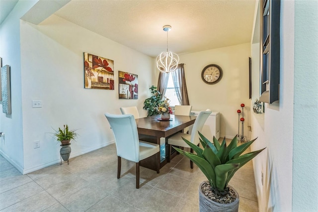 2815 Shelburne Way, Saint Cloud, FL 34772 - dining space featuring an inviting chandelier, baseboards, and a textured ceiling