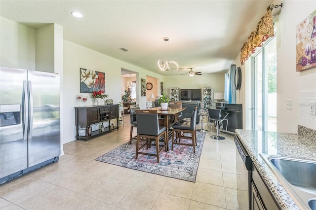 2815 Shelburne Way, Saint Cloud, FL 34772 - dining space with recessed lighting, ceiling fan with notable chandelier, and light tile patterned floors