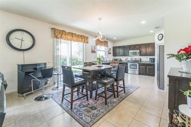 2815 Shelburne Way, Saint Cloud, FL 34772 - dining room featuring light tile patterned floors, baseboards, recessed lighting, and visible vents