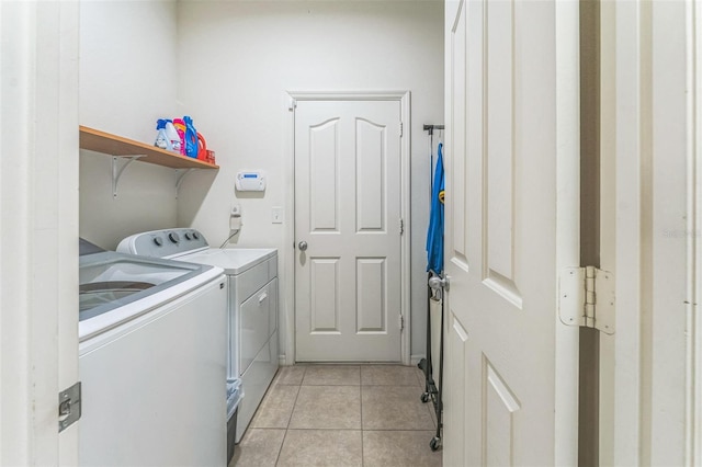 2815 Shelburne Way, Saint Cloud, FL 34772 - laundry area featuring laundry area, washing machine and dryer, and light tile patterned flooring
